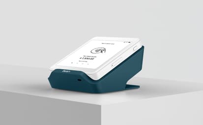 Thumbnail of a hand scanning a QR code with a payment terminal